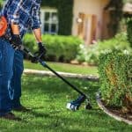 man using a gas string trimmer