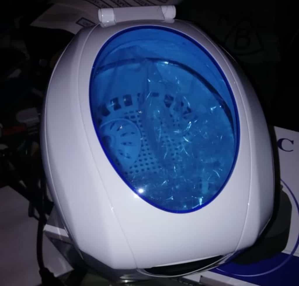 white ultrasonic cleaner with blue door