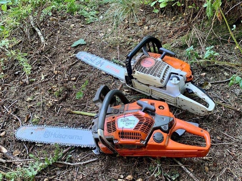 Chainsaws Lying On Ground