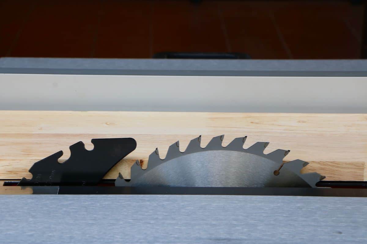 table saw blade in front of wood