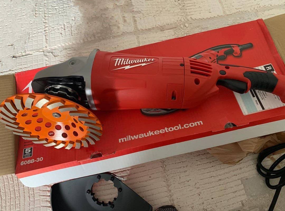 Millwaukee angle grinder lies on the box